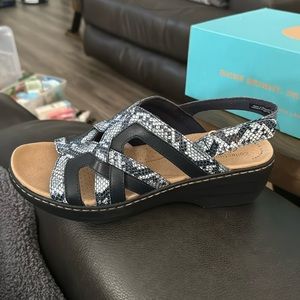 Collection by Clarks. Never worn. Women’s size 9.5, Navy Snake